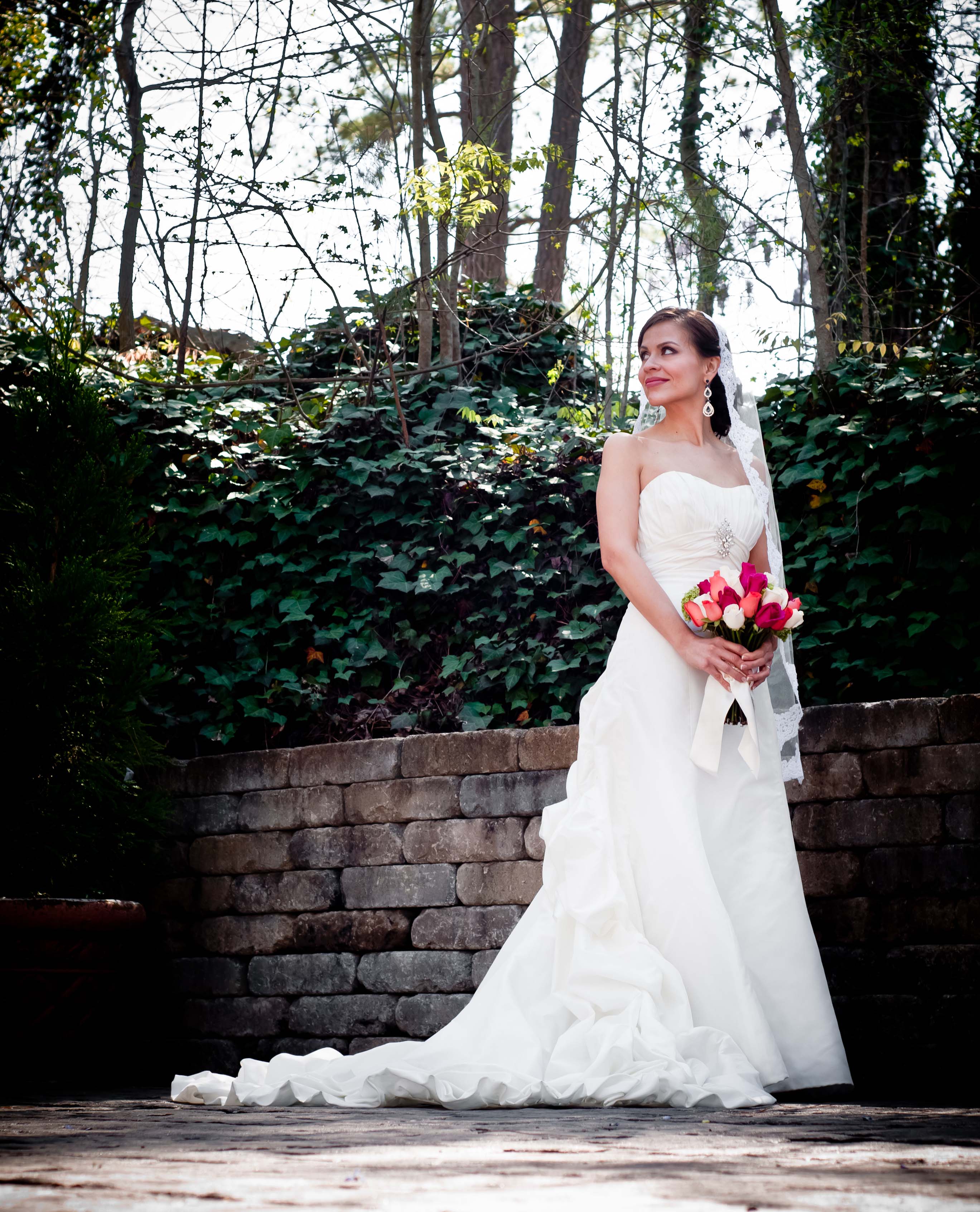 Gala facility bride at outdoor wedding venue holding roses